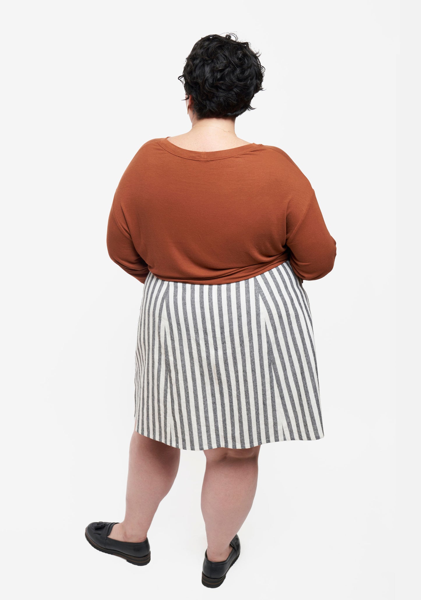 Back view of Reed Skirt in striped fabric showing center back seam and flared shape.