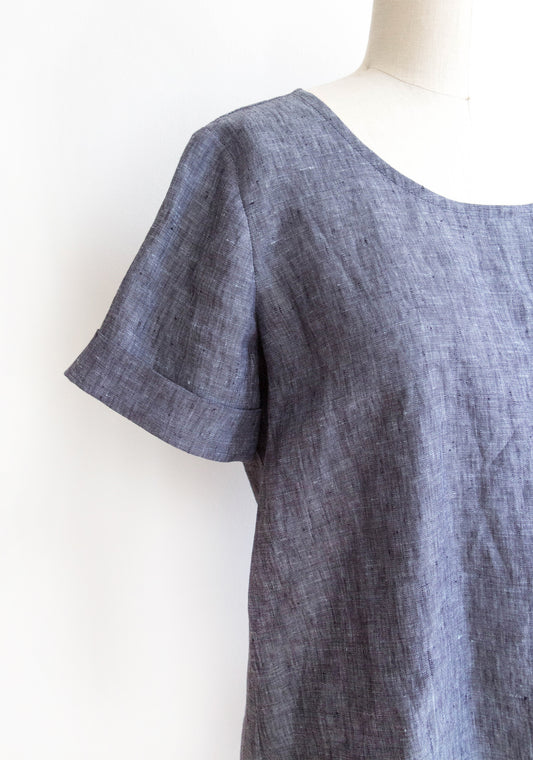 Close-up of Scout Tee short sleeve add-on in chambray fabric on dress form.
