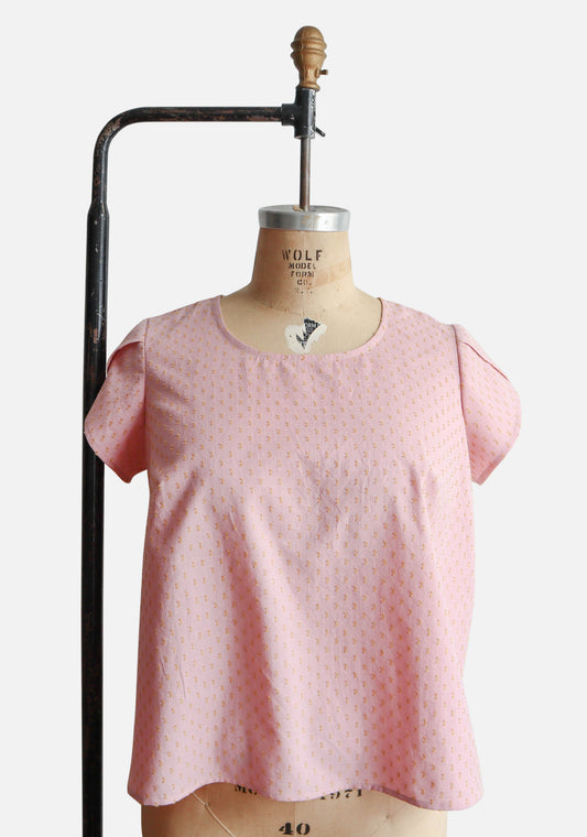 Scout Tee with petal sleeves sewn in pink dotted fabric, displayed on dress form.