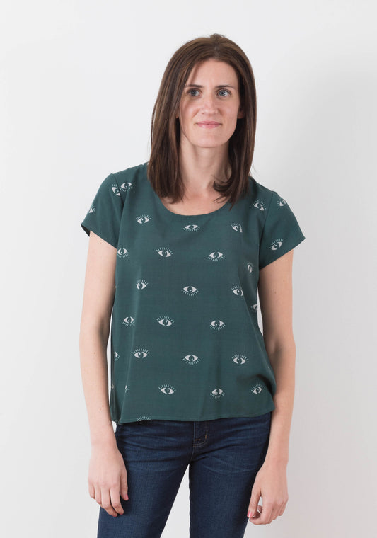 Model: Size 6, 5'8" |Model wearing green Scout Tee with eye print facing front, arms at sides.