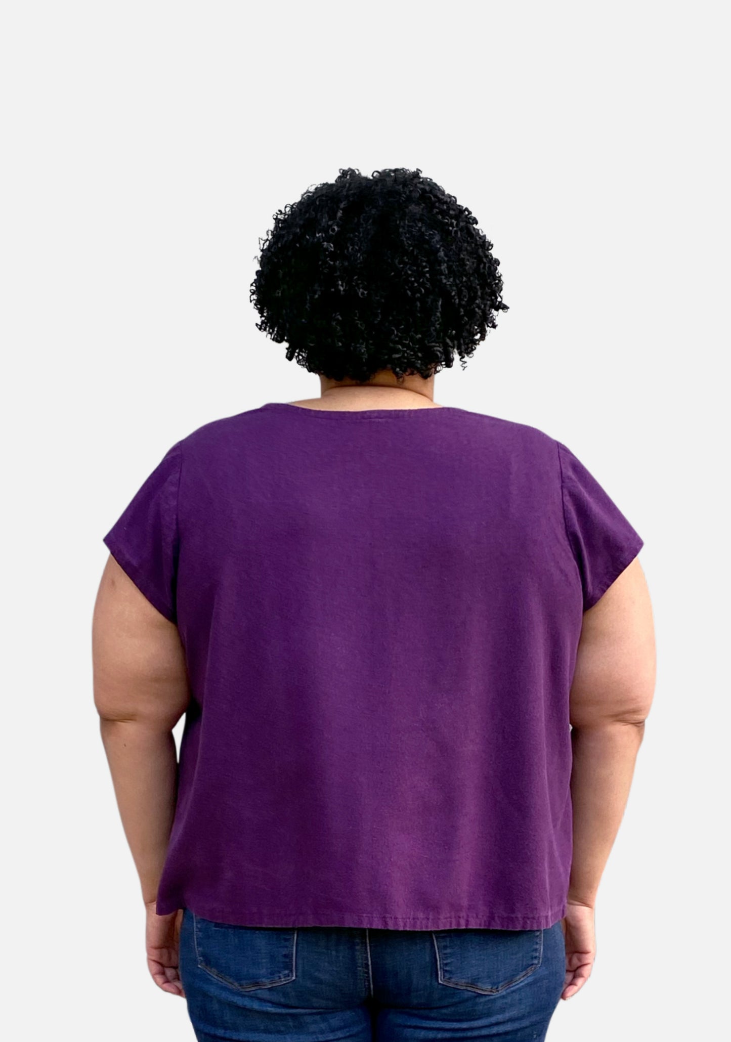 Back view of the Scout Tee showing short sleeves, a scoop neckline, and a loose silhouette.