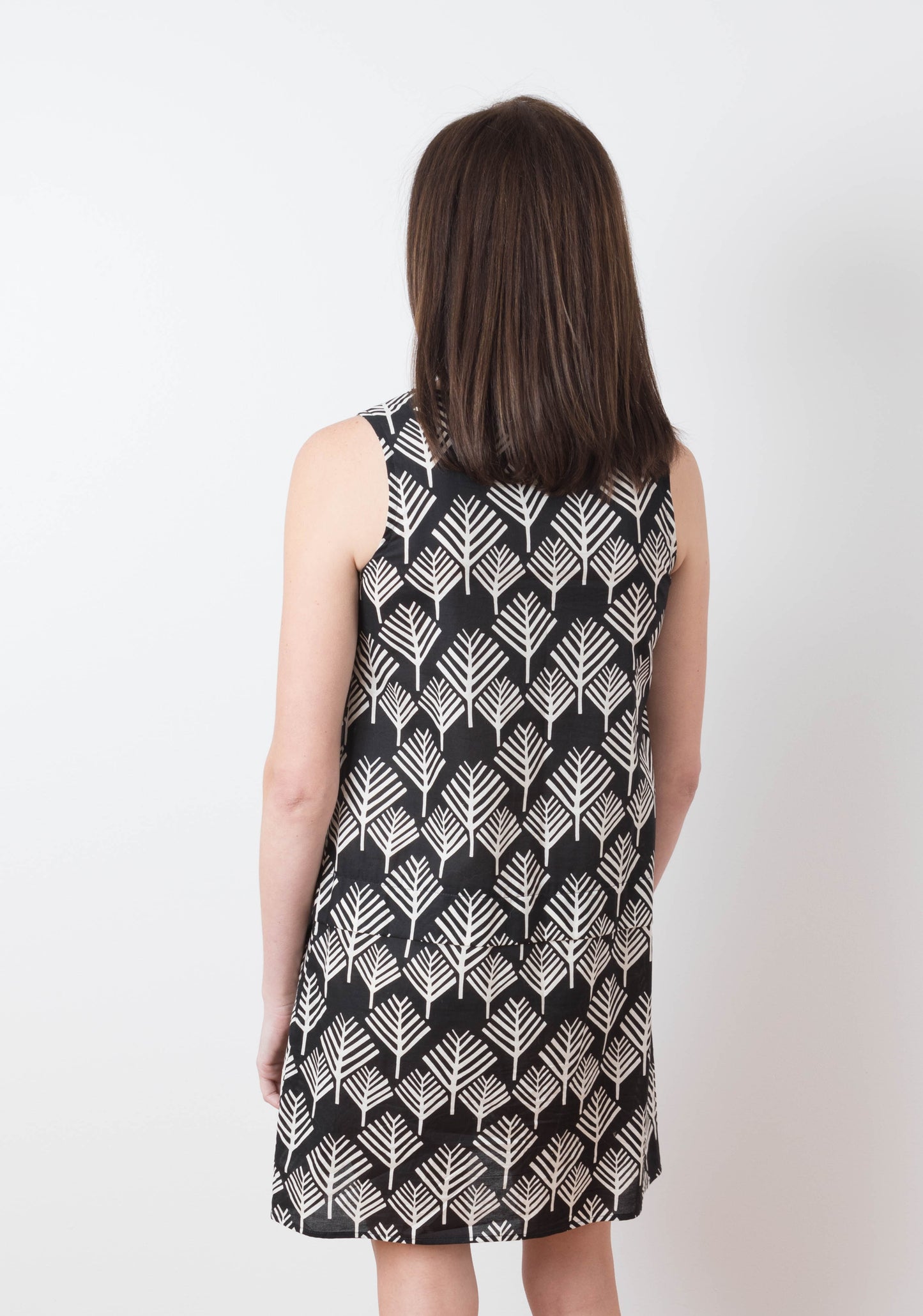 Back view of Willow Dress in black and white geometric print fabric, View B, worn by model.