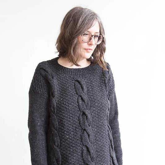 Charcoal grey cabled knit crewneck sweater with double moss stitch texture and vertical cable detail down the center front