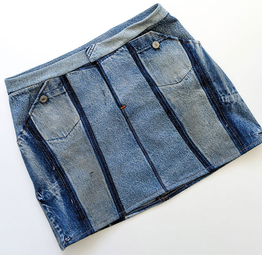 Moss Skirt upcycled from old jeans in mixed light and dark wash denim, vertical seamed panels and button waistband