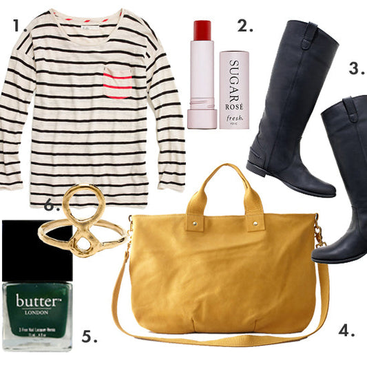 Fall outfit flat lay: striped long-sleeve tee, black riding boots, mustard tote, gold ring, lip balm, and green nail polish