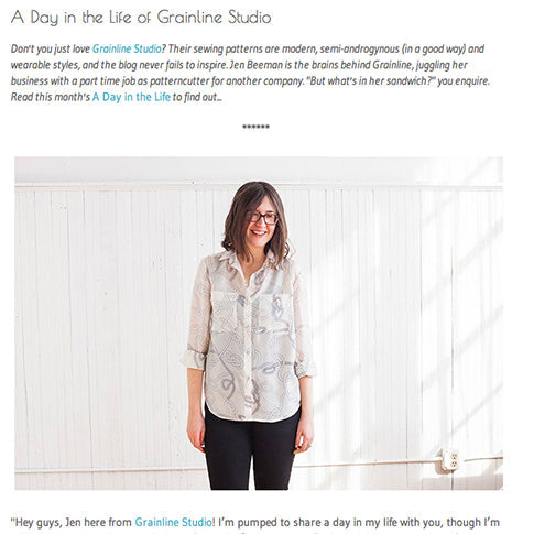 Grainline Studio blog feature showing Jen in a cream printed Archer Button-Up and black pants against a white shiplap wall