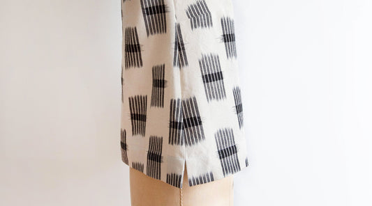 Willow Tank in black and white ikat print with split hem detail showing vertical slits at garment sides