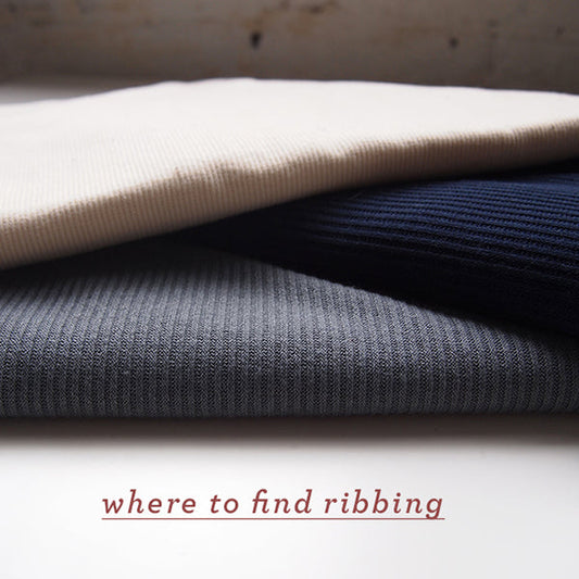 Three folded ribbed knit fabrics in cream, navy, and gray with where to find ribbing text overlay