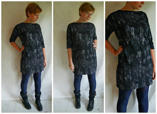 Three views of Hemlock Tee dress in black and gray paint-smear print jersey, styled with navy tights and black ankle boots