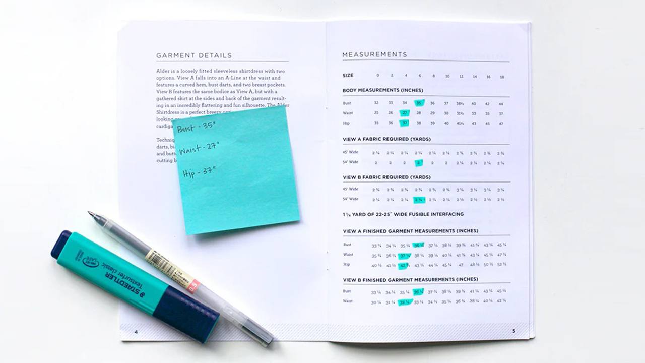 Alder pattern booklet showing size chart with highlighted size 6 measurements, sticky note with bust, waist, hip notes, pen and highlighter
