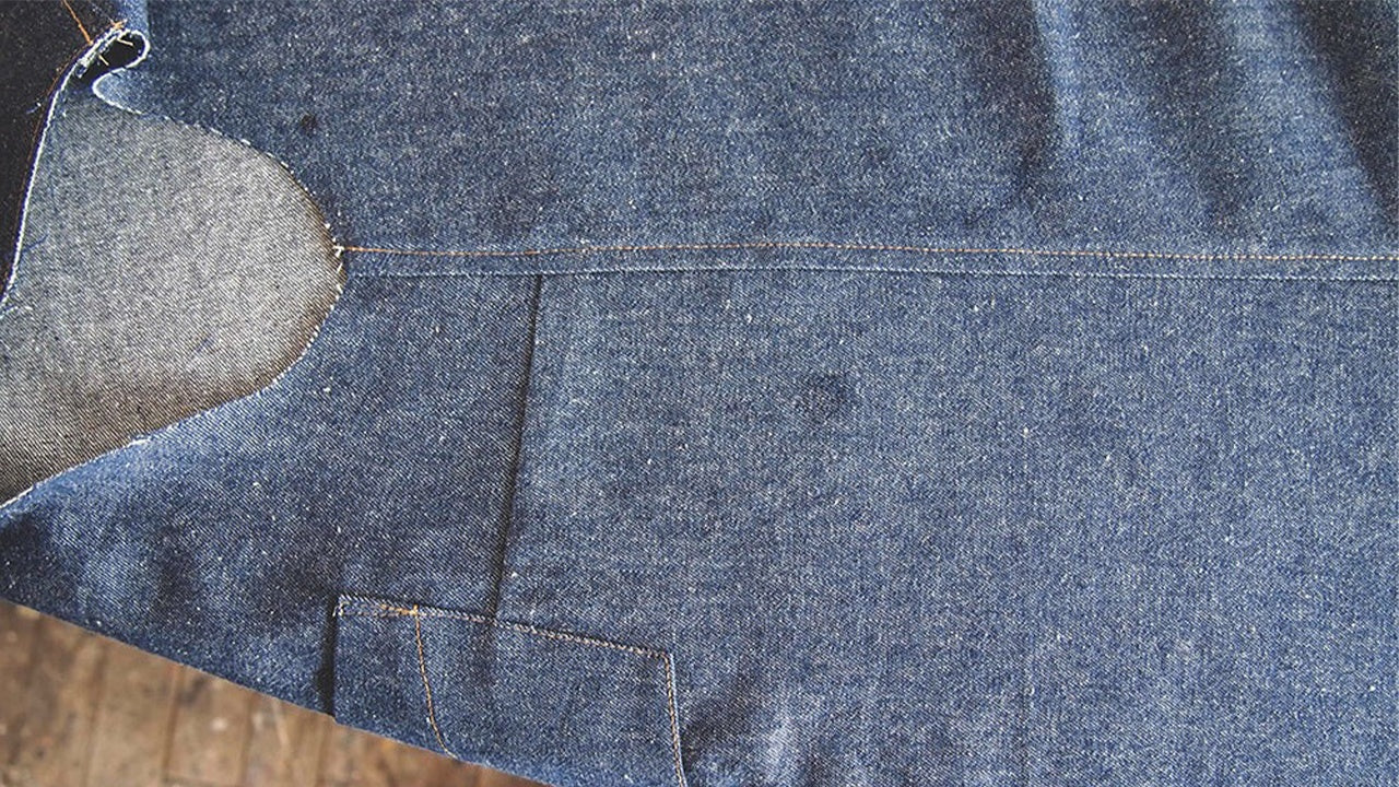 Alder View A side seam on denim showing faux flat-felled topstitching with serged seam allowance pressed to back