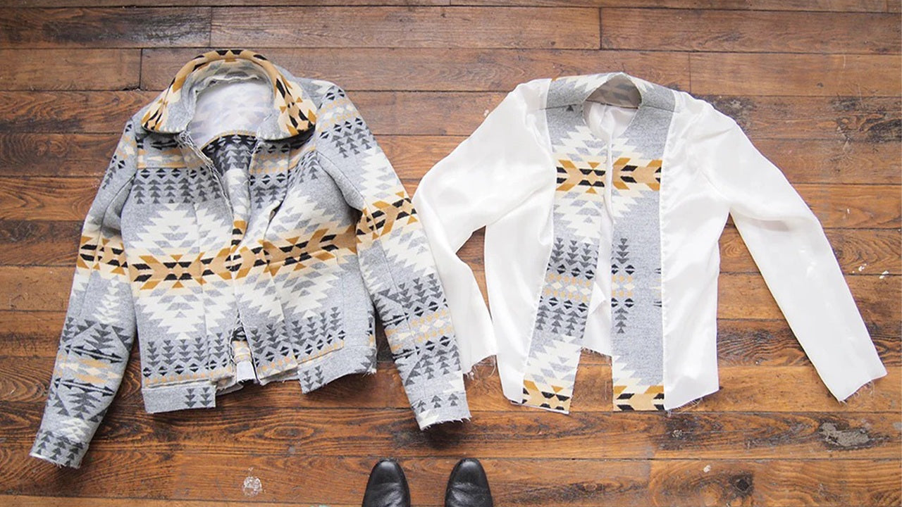 Cascade coat shell and lining laid side by side on wood floor showing geometric print wool exterior and white Bemberg lining