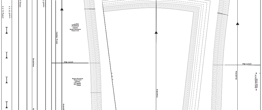Sewing pattern tissue pieces for pants or bottoms with grainlines, hip level markings, and size notations