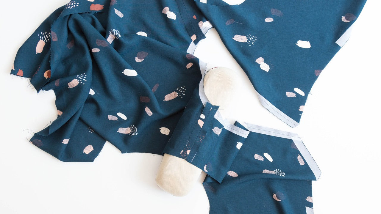 Felix Dress neckband pieces sewn together with interfacing visible, showing construction stages on abstract print fabric