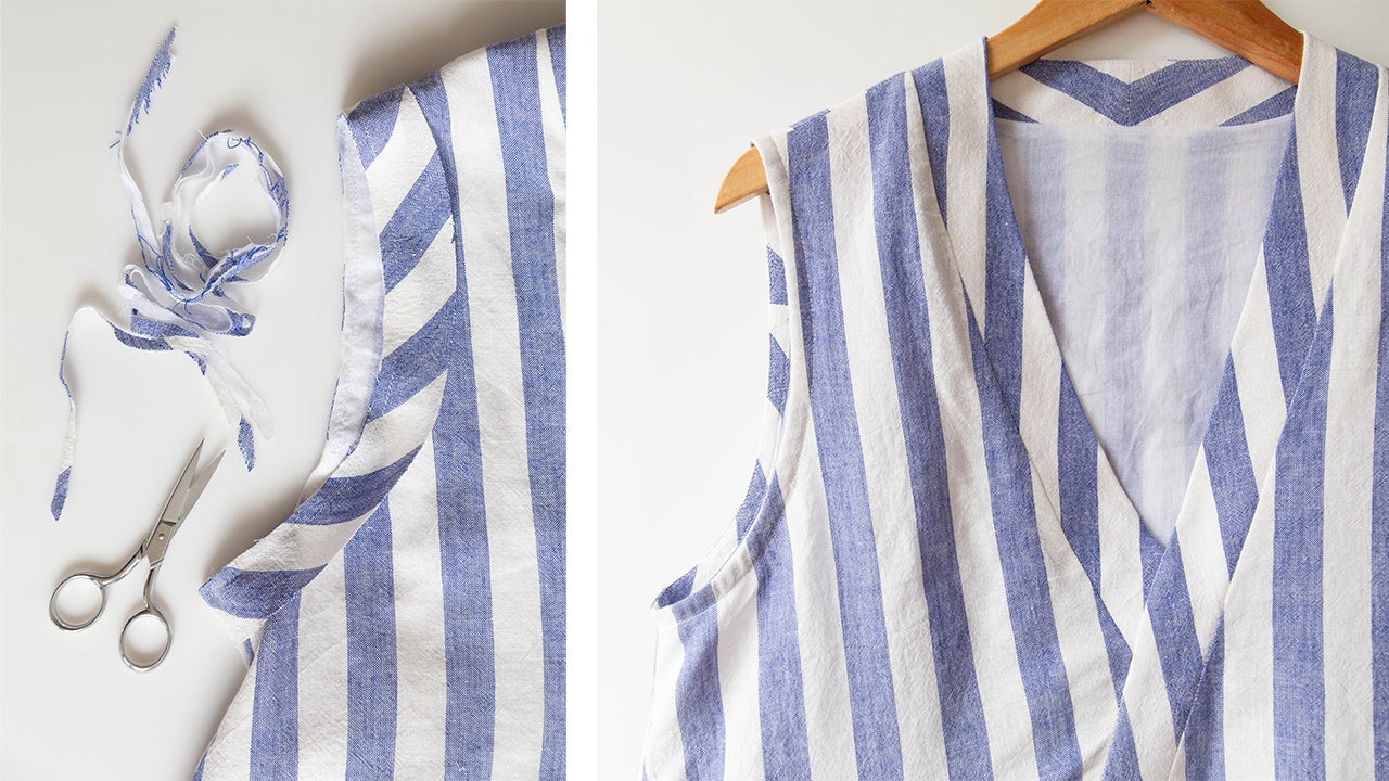 Sleeveless Felix Dress in blue and white striped linen showing bias facing applied to armholes with scissors and ties nearby