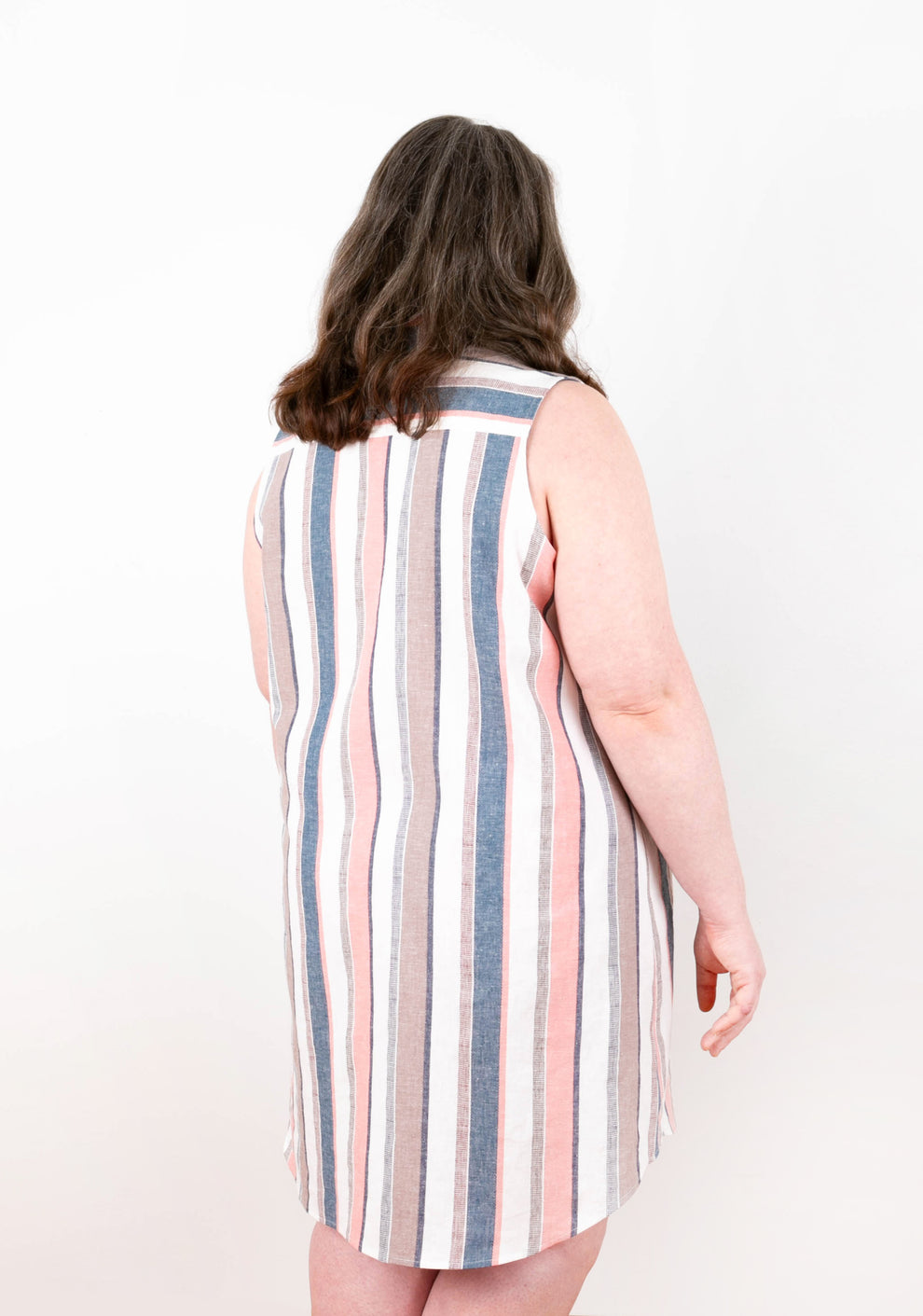 Back view of Alder Shirtdress View A in striped fabric showing yoke seam and curved hem.