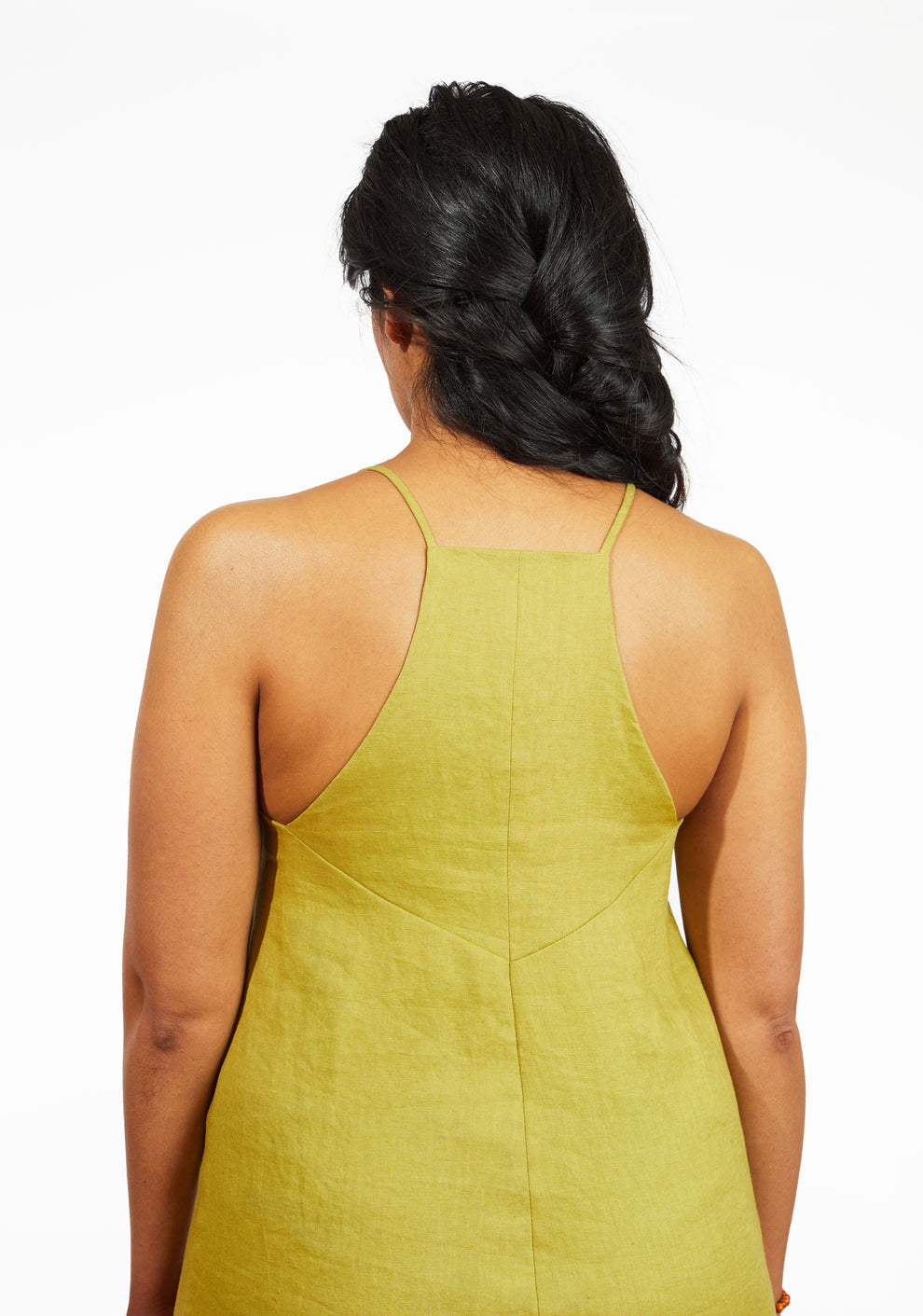 Close-up of Myra Dress upper back showing strap placement and seam shaping in chartreuse linen, sizes 0-18.