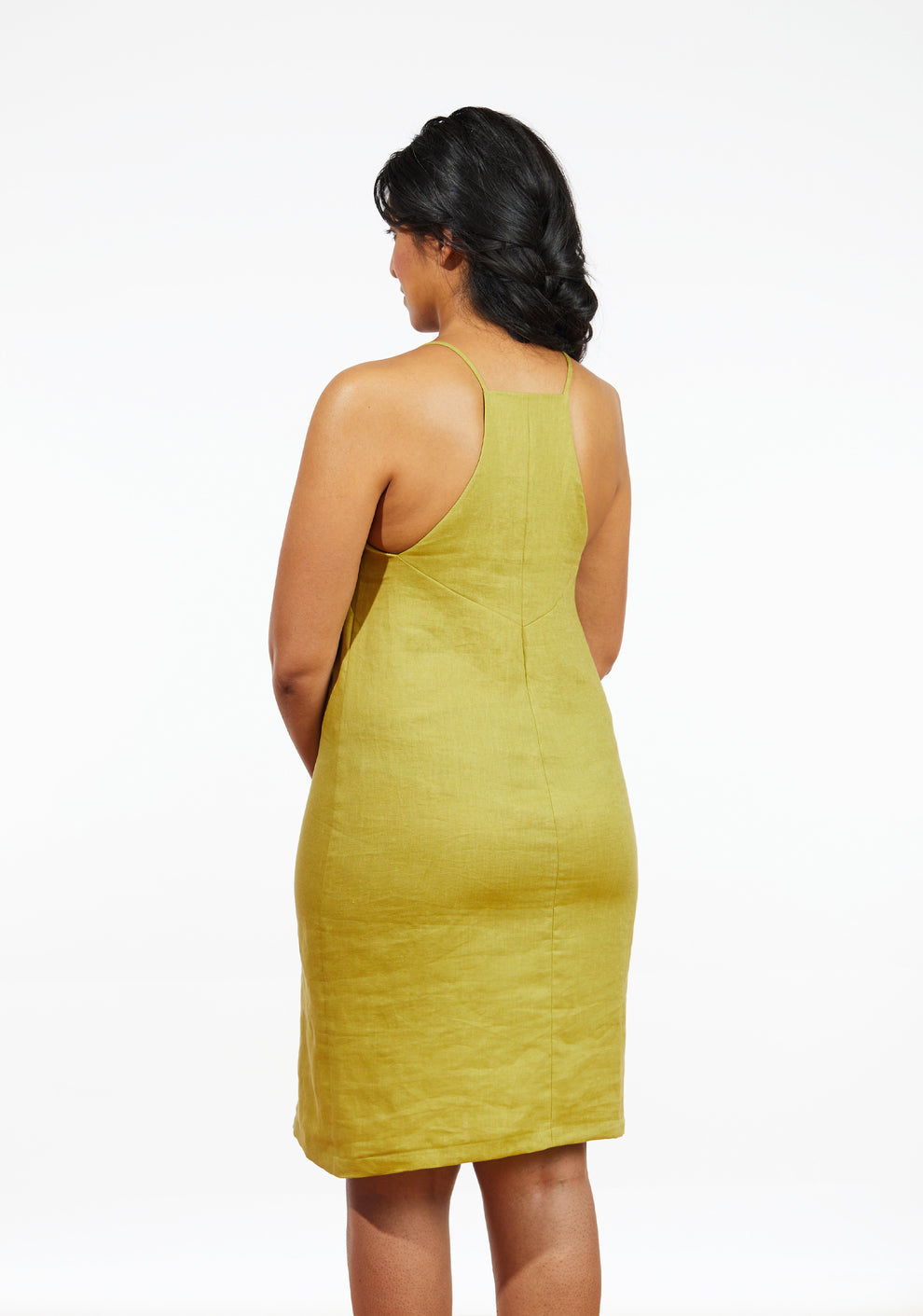 Back view of Myra Dress in chartreuse linen showing fit and seam shaping, sizes 0-18.