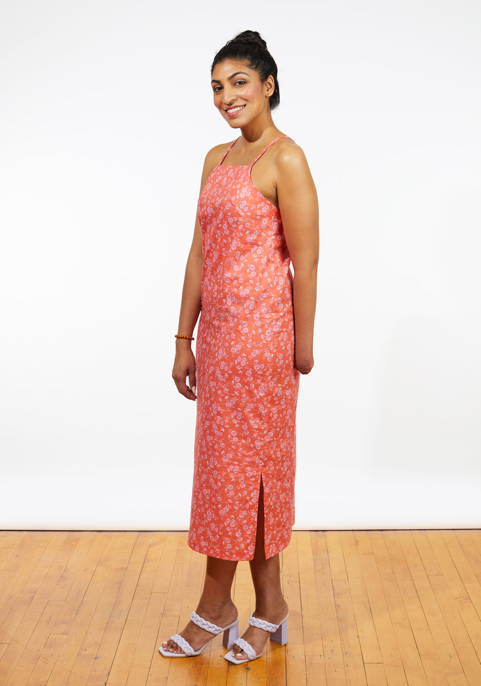 Side view of Myra Dress in coral floral print with square neckline and side slit, sizes 0-18.