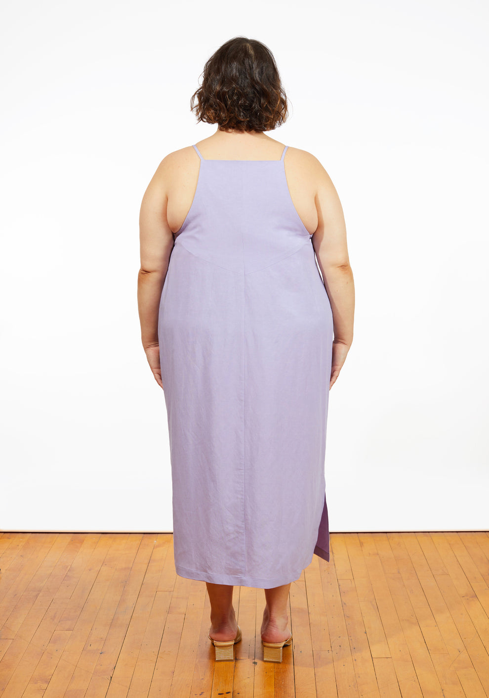 Back view of Myra Dress in lilac linen, angled back seam detail with narrow straps.