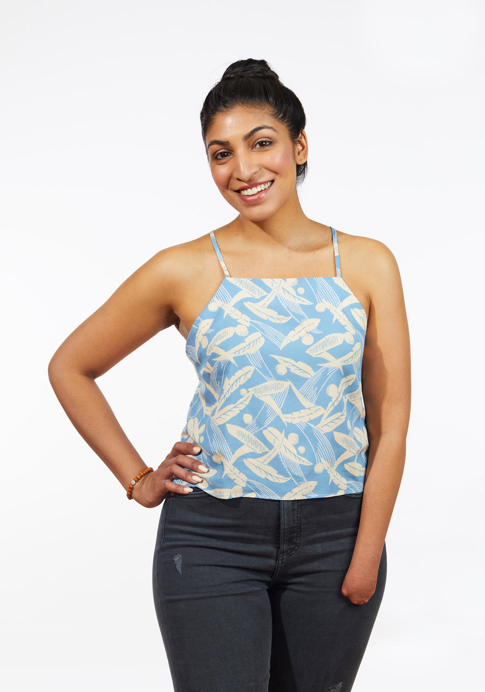 Model: Size 8, 5'9" | Front view of Myra Top in pale blue feather print with fitted silhouette, sizes 0-18.
