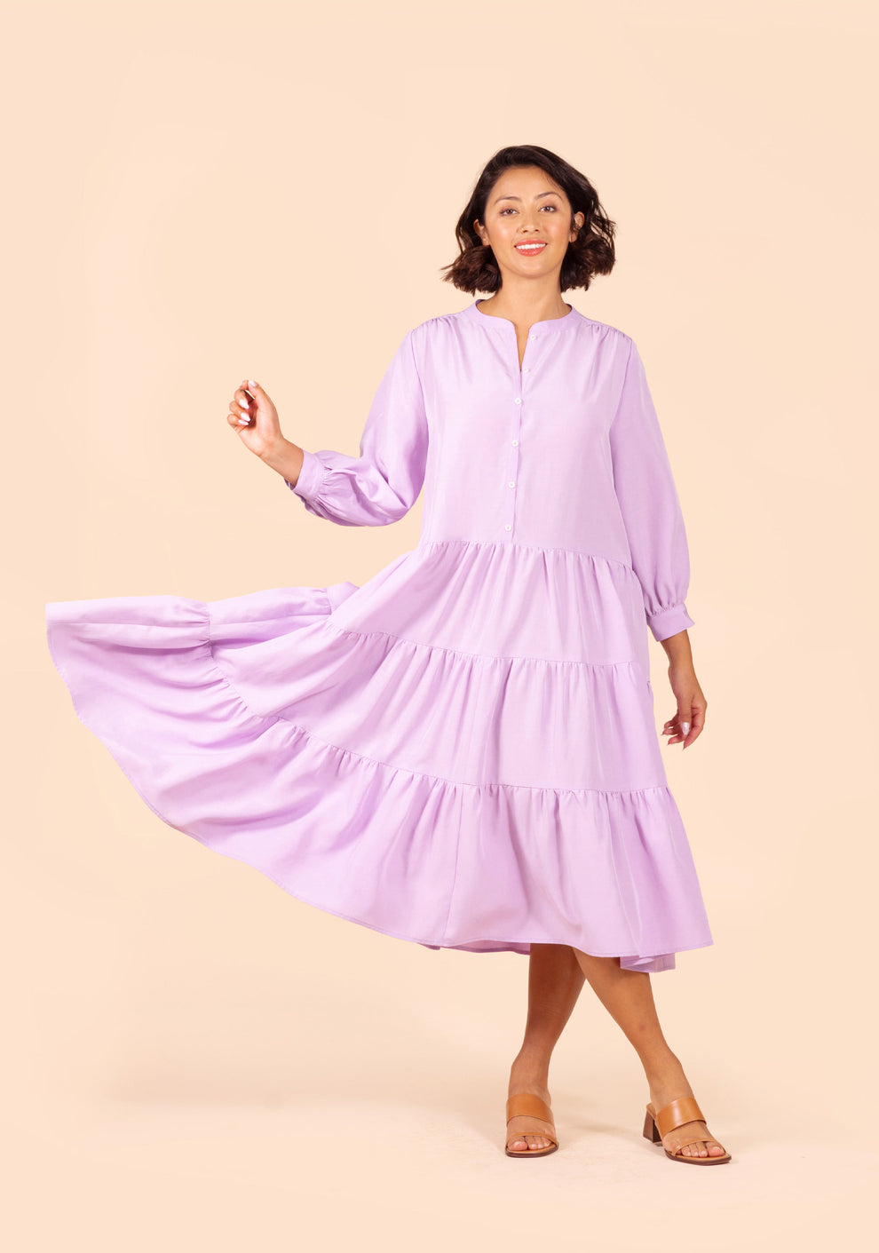 Front view of Poppy Dress View D in lilac, showing tiered skirt in motion.
