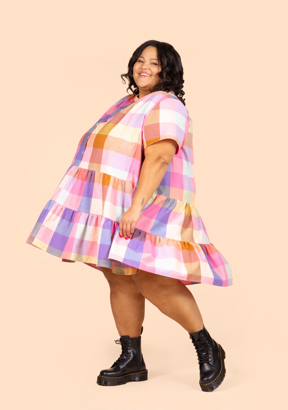 Side view of short Poppy Dress View A flaring outward as model spins, showing movement and shape.