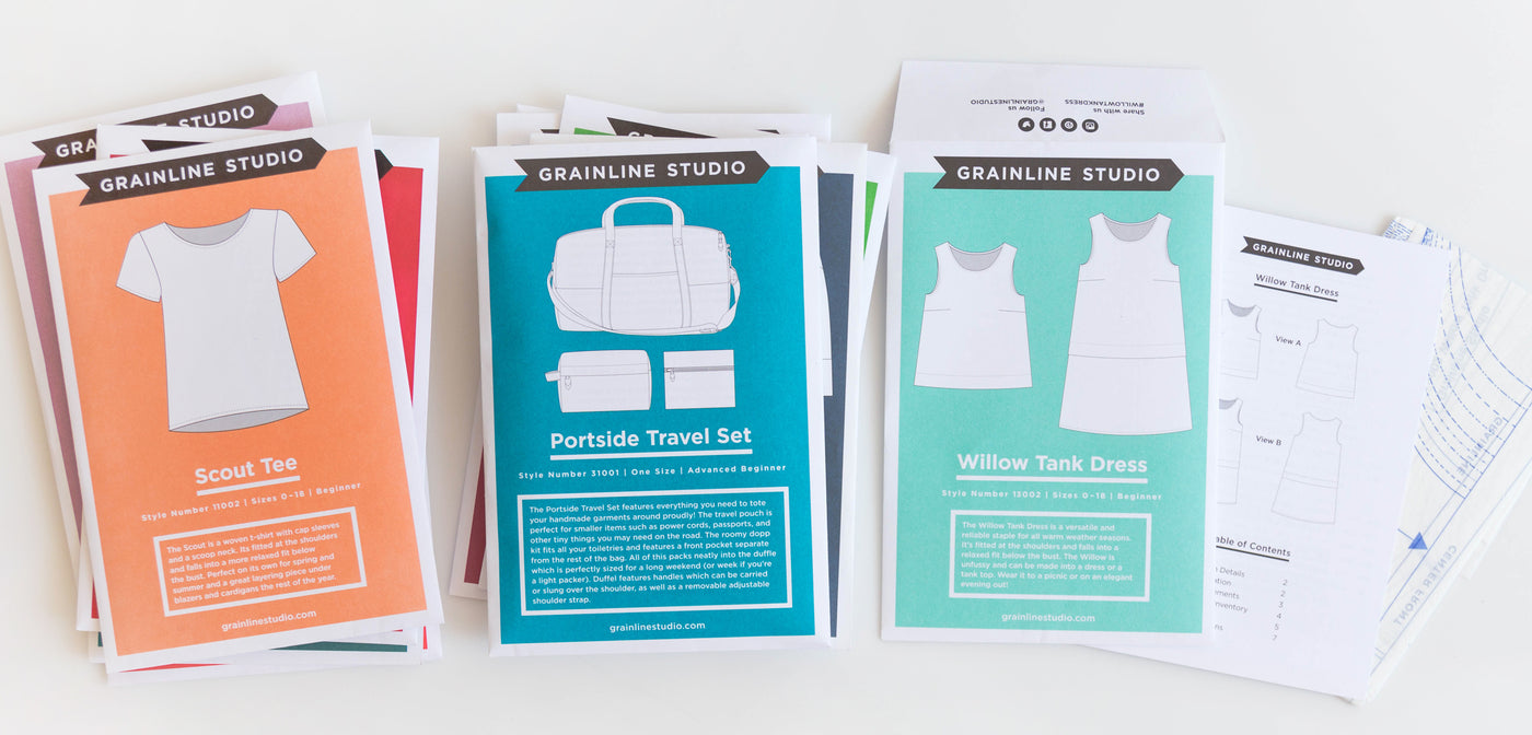 Grainline Studio sewing pattern tissue sheets including Scout Tee, Portside Travel Set, and Willow Tank Dress