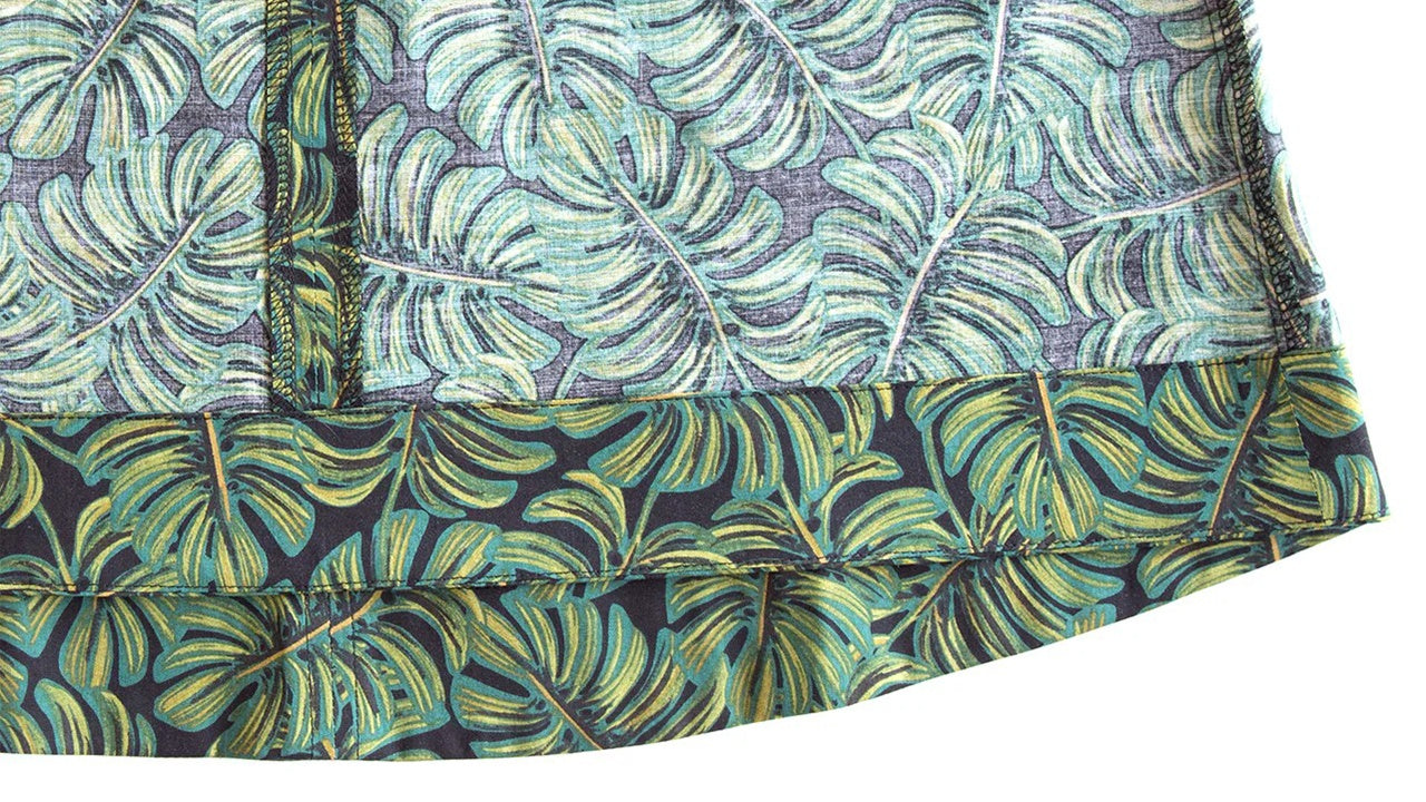 Close-up of Hadley hem showing deep curved facing in palm leaf print attached and understitched for clean finish.