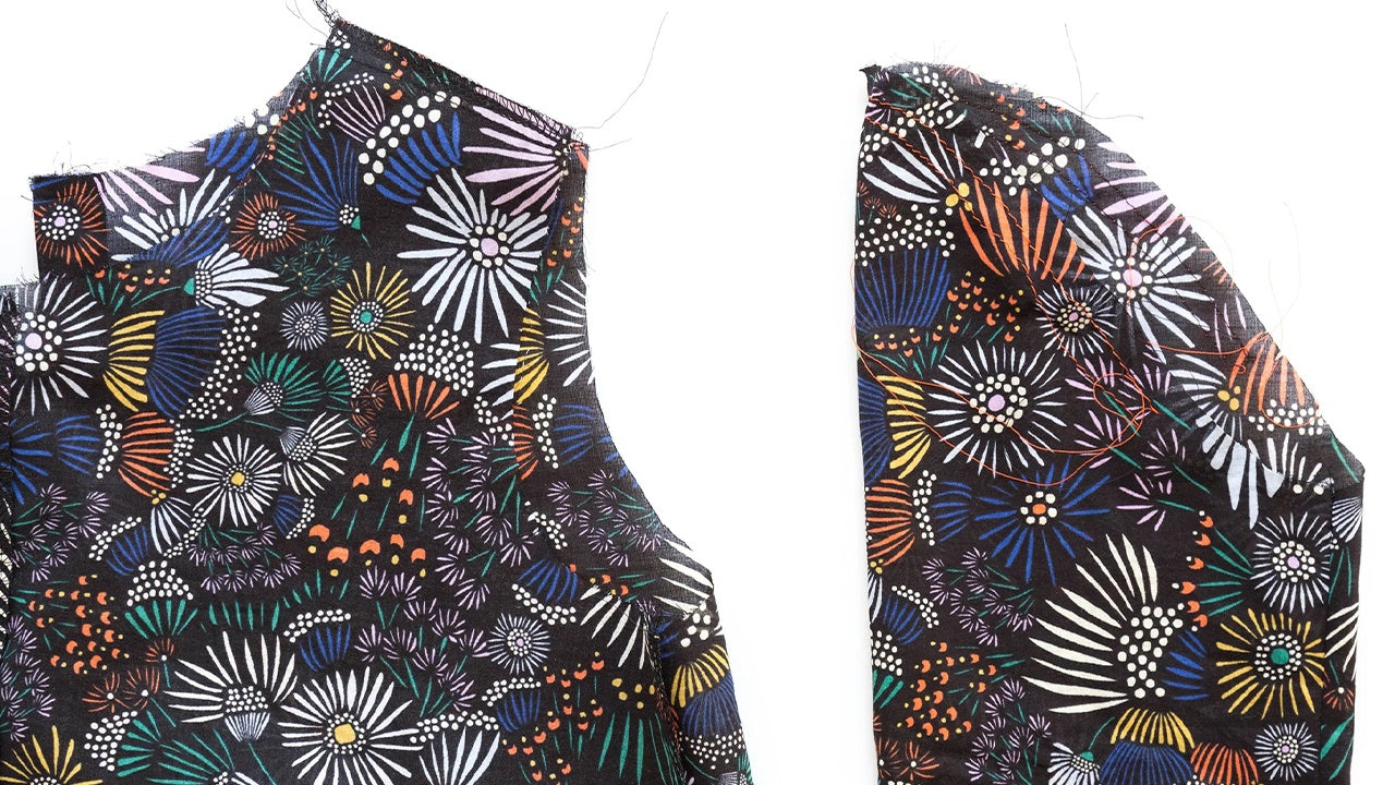 Close-up of Hadley View A sleeve construction showing gathered sleeve cap with basting stitches and set sleeve in armhole.