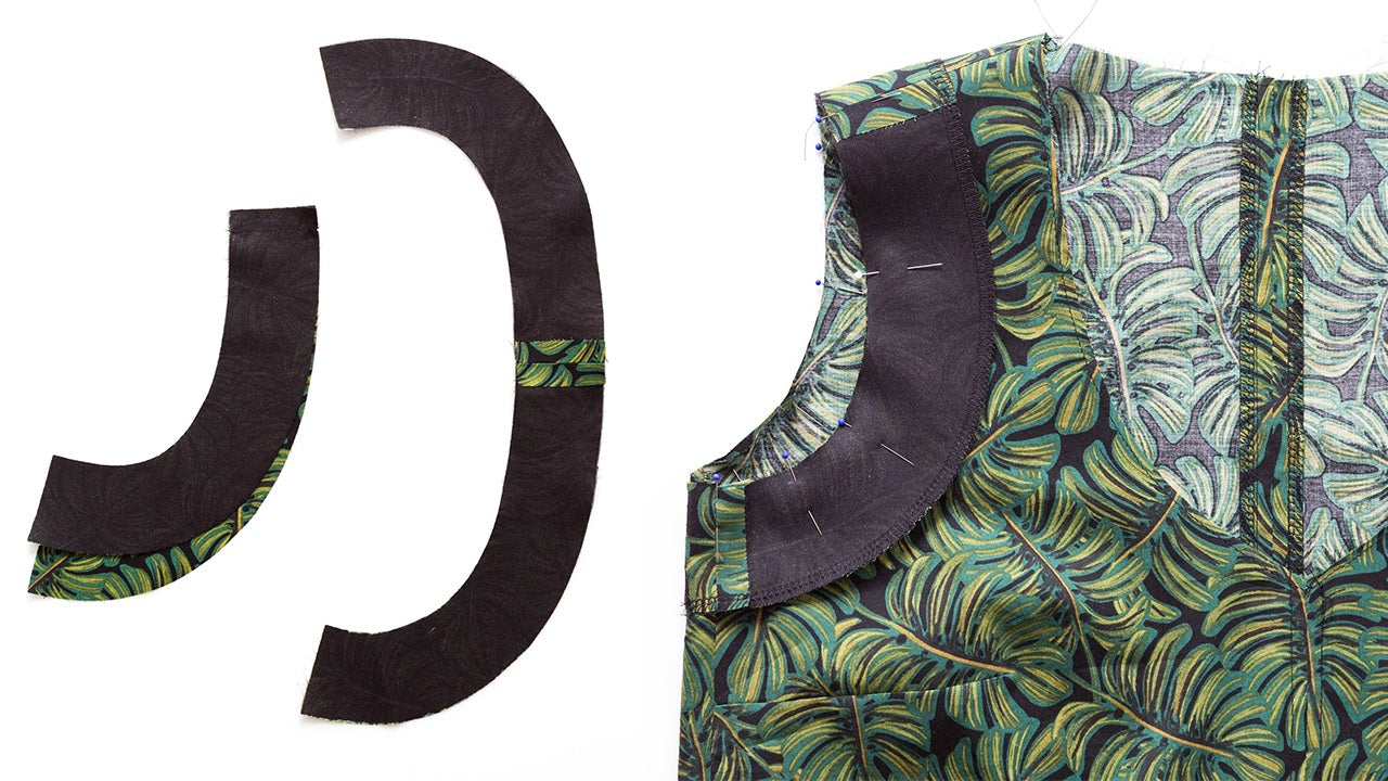 Fused armhole facings laid flat and pinned to palm leaf print Hadley bodice showing circular facing construction and placement