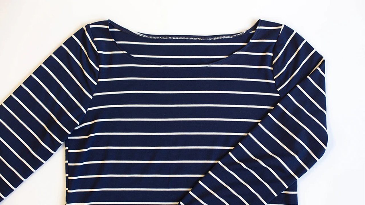 Completed Lark Tee boat neck in navy and white striped jersey showing finished topstitched neckline with 3/4 sleeves