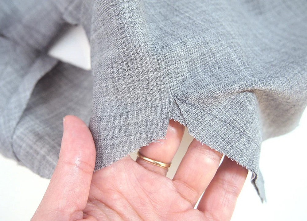 Morris Blazer shoulder seam showing clipped corner at shawl collar intersection on gray stretch wool fabric