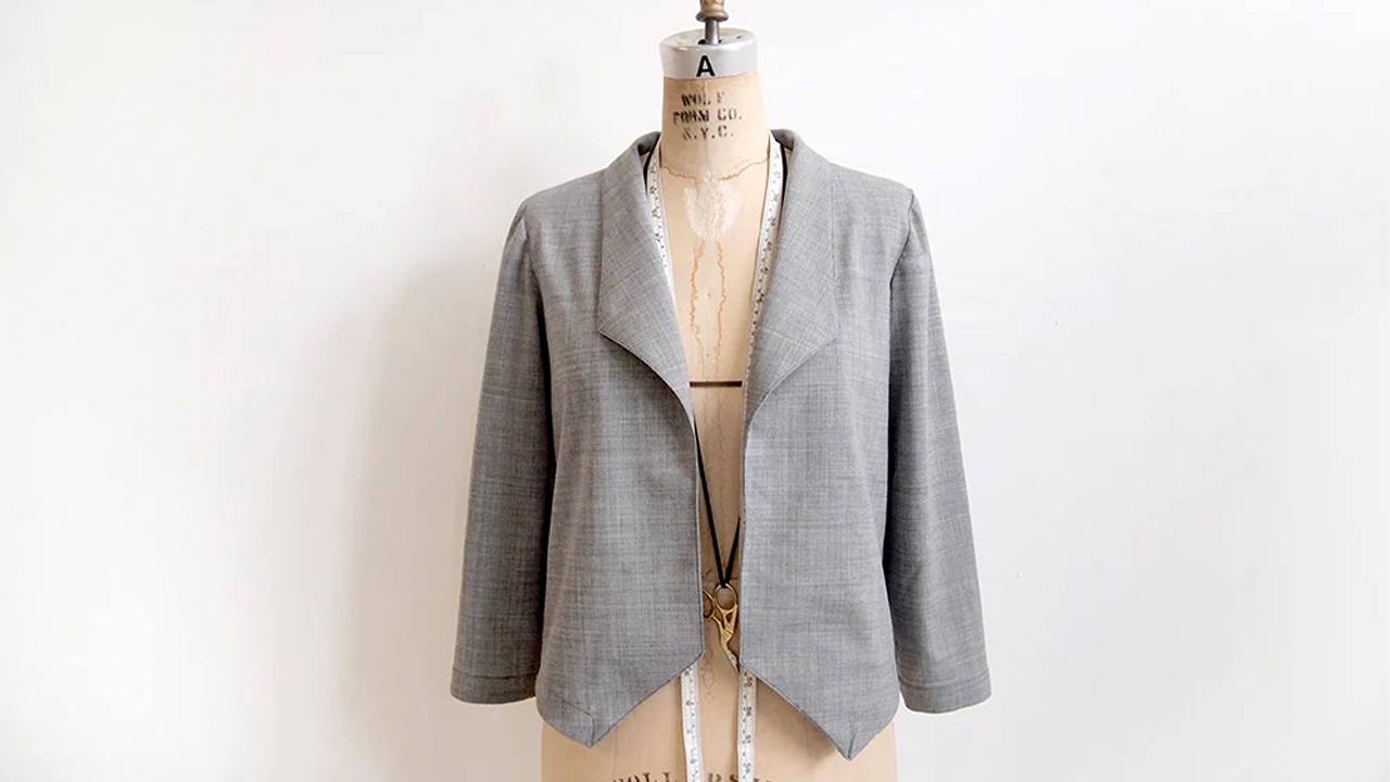Completed Morris Blazer in gray stretch wool on dress form showing shawl collar, bracelet sleeves, and open front styling