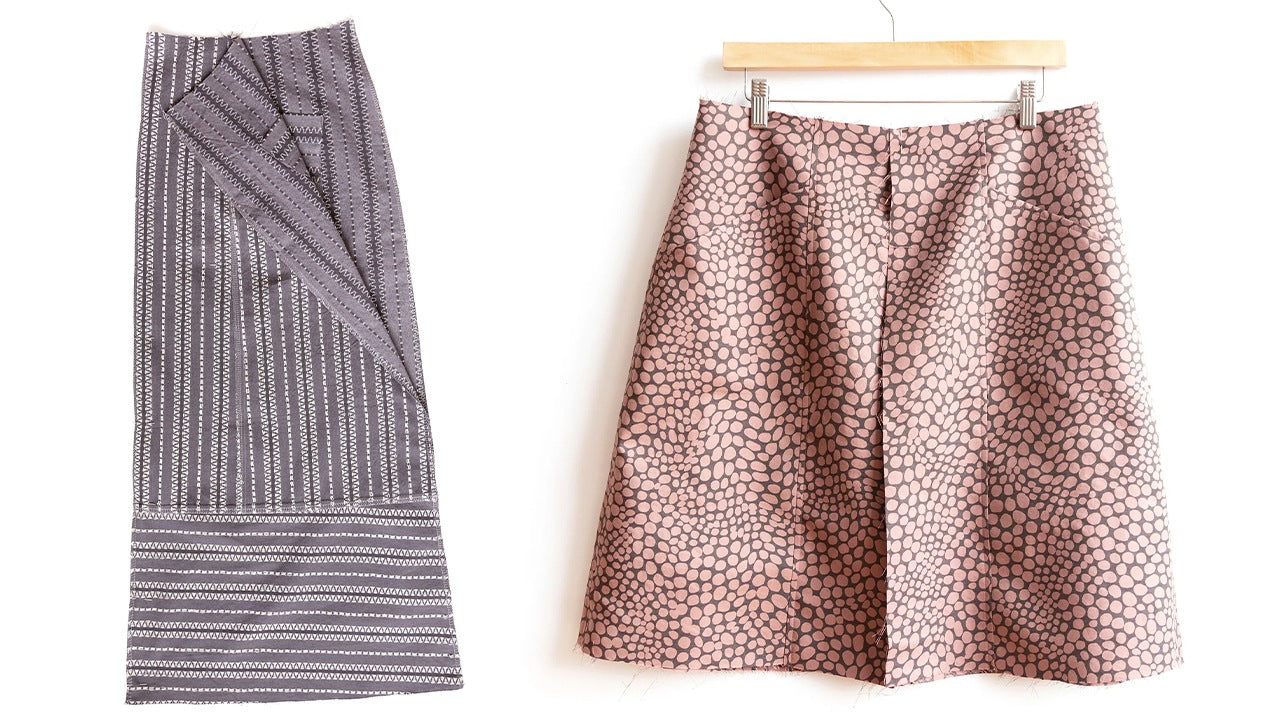 Gray geometric print skirt in progress on left showing topstitched seams, completed pink dot print skirt on right hanging on hanger