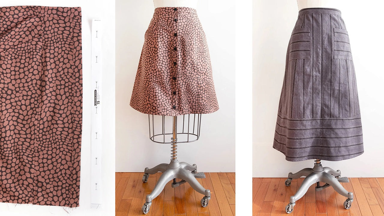 Pink dot print fabric with button template on left, completed button-front skirt on dress form center, gray geometric skirt on righ