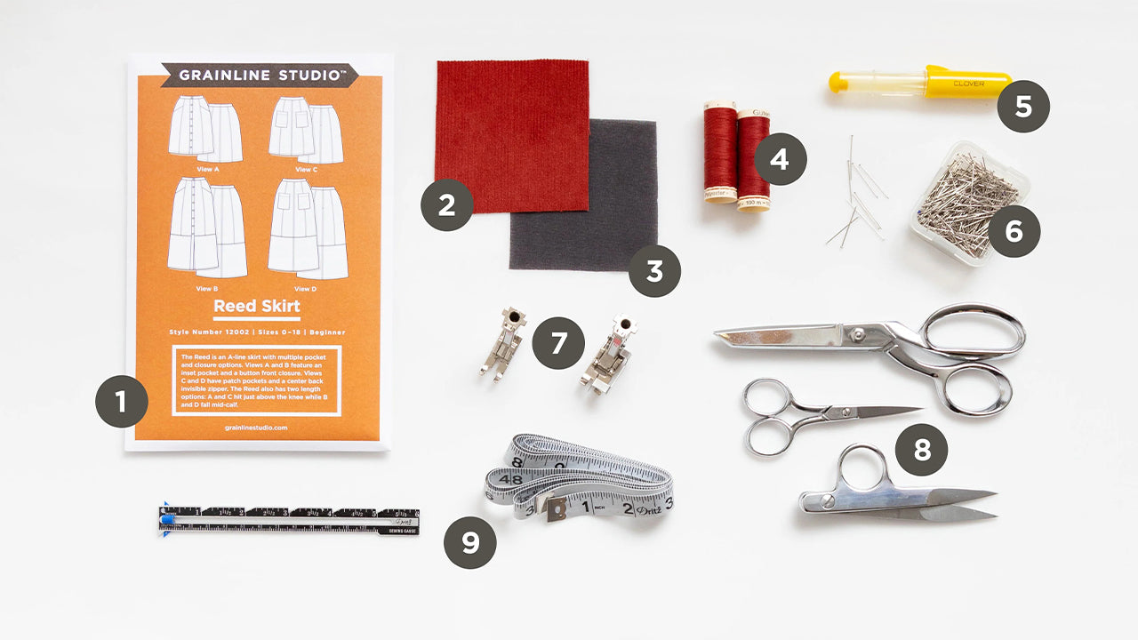 Reed Skirt sewing supplies laid out: pattern envelope, fabric swatches, thread, marking pen, pins, scissors, and tape measure