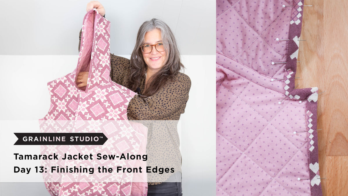 A quilted Tamarack jacket front in pink floral print held up showing the lining side with binding pinned along the front opening edge ready to be stitched