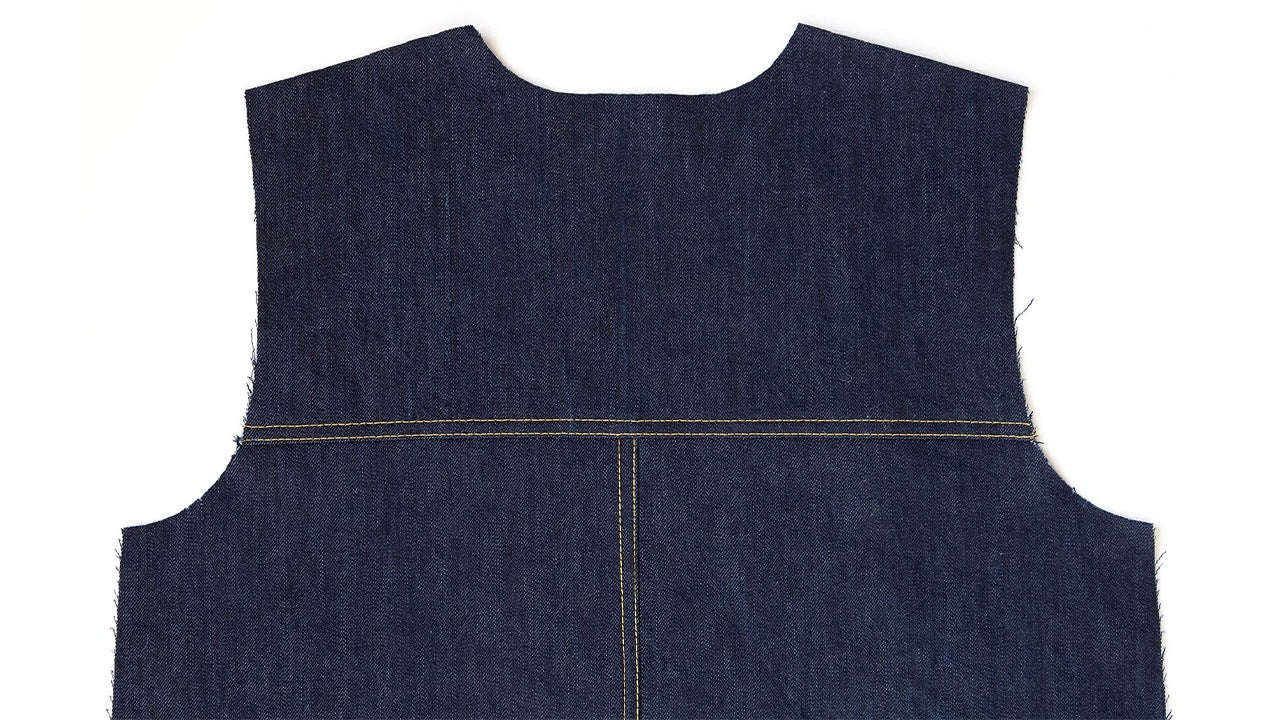Thayer Jacket back in navy denim showing center back seam and yoke attachment with topstitching detail