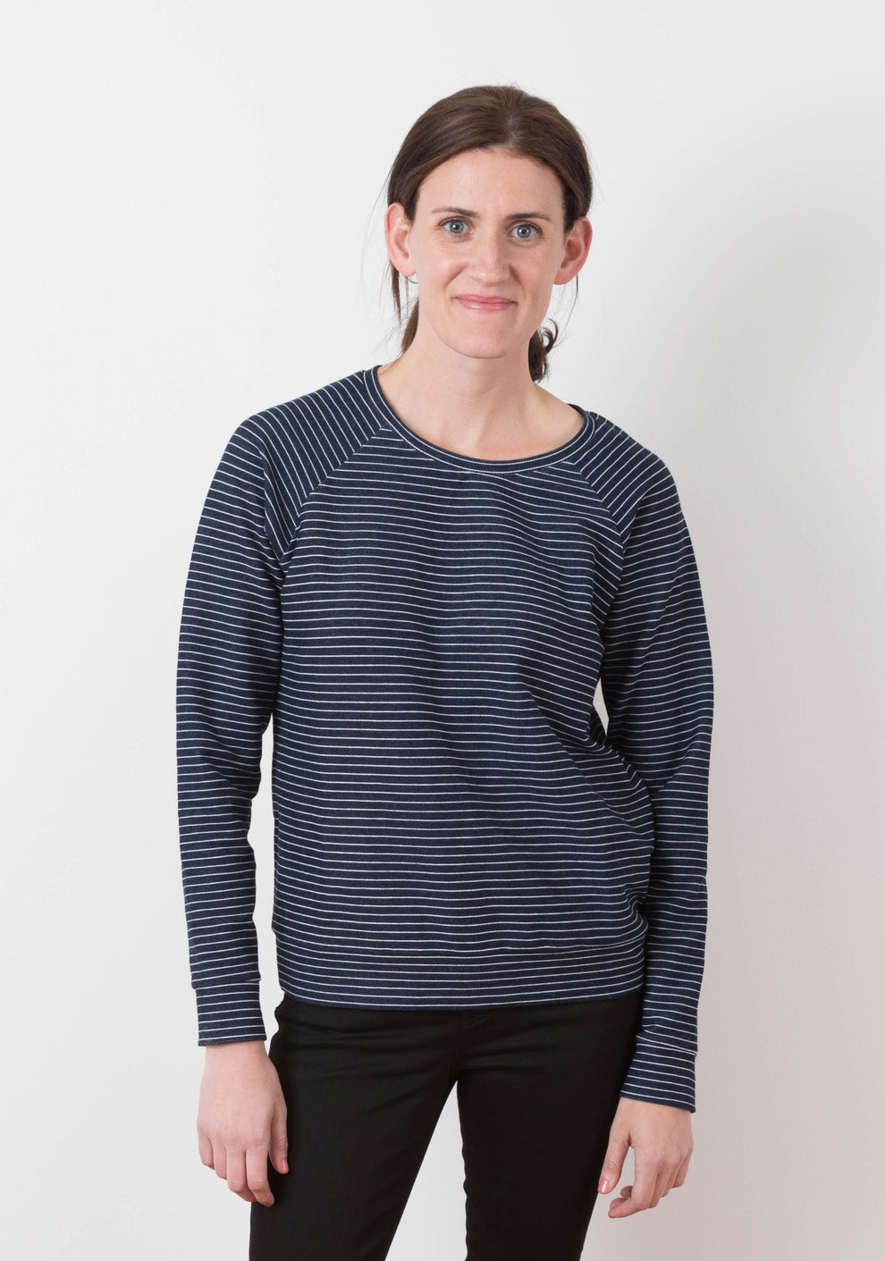 Front view of a long-sleeve Linden Sweatshirt in navy and white striped knit with raglan sleeves.
