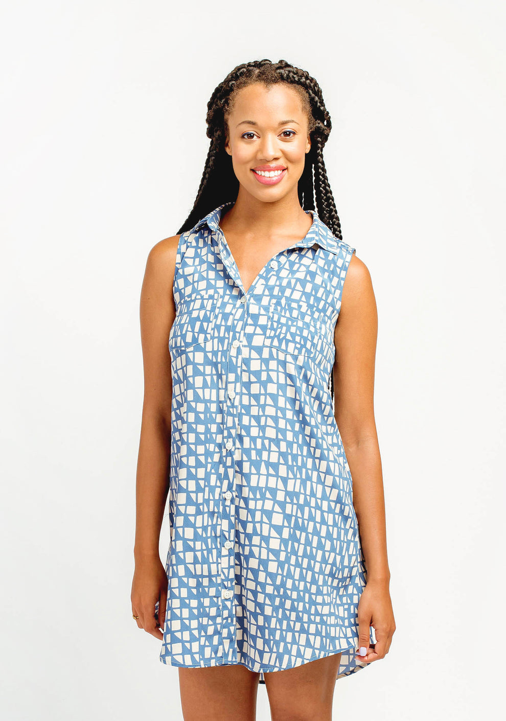 Front view of sleeveless blue printed Alder Shirtdress with button front and collar, worn by model.