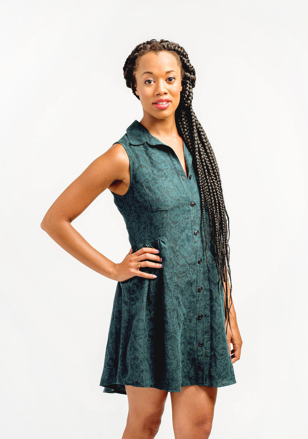 Model: Size 8, 5'9" | Front view of sleeveless green Alder Shirtdress with collar and gathered skirt, worn by model.
