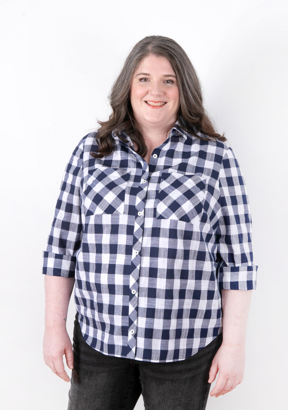 Model: Size 20, 5'5" | Archer Button Up View A, front view with rolled sleeves, gingham fabric, size 14-32.