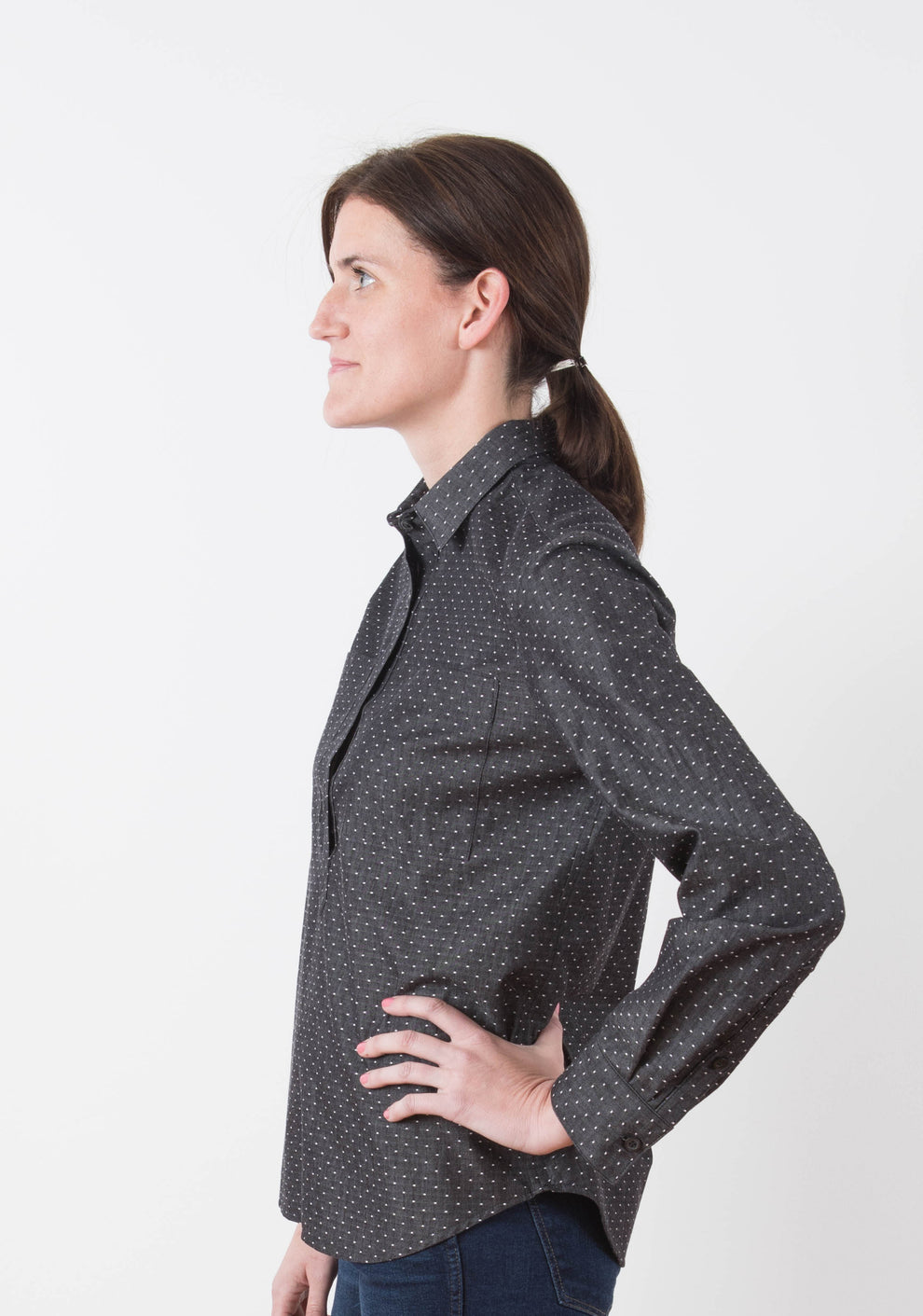 Side view of person wearing the Archer Popover shirt with buttoned cuff and classic collar.