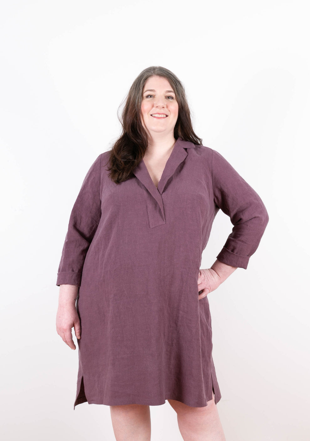 Front view of Augusta Dress with cuffed long sleeves in plum linen, featuring a wide V-notch neckline and relaxed fit.