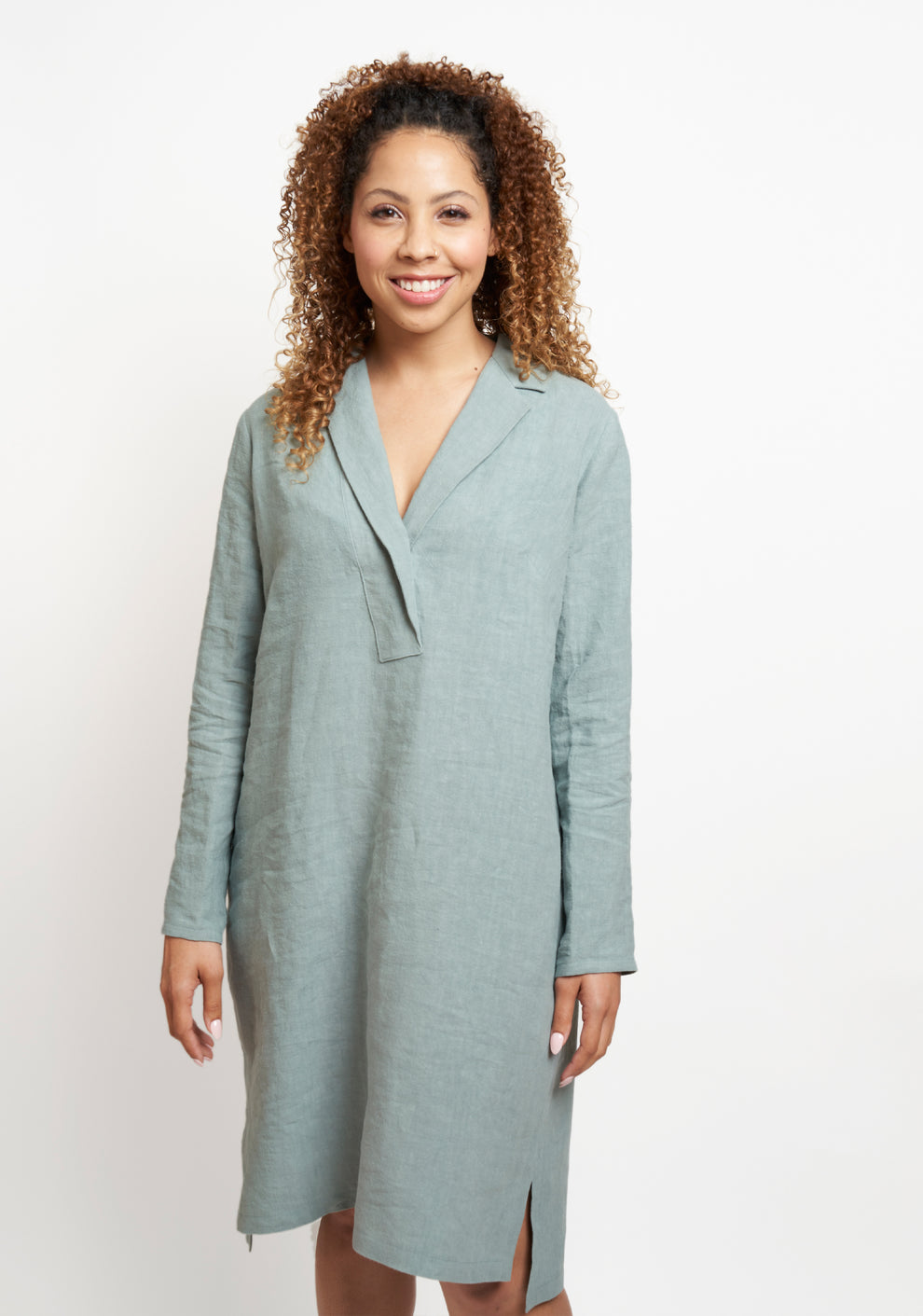 Front view of Augusta Dress in soft blue-green linen, featuring long sleeves and a soft notched collar.
