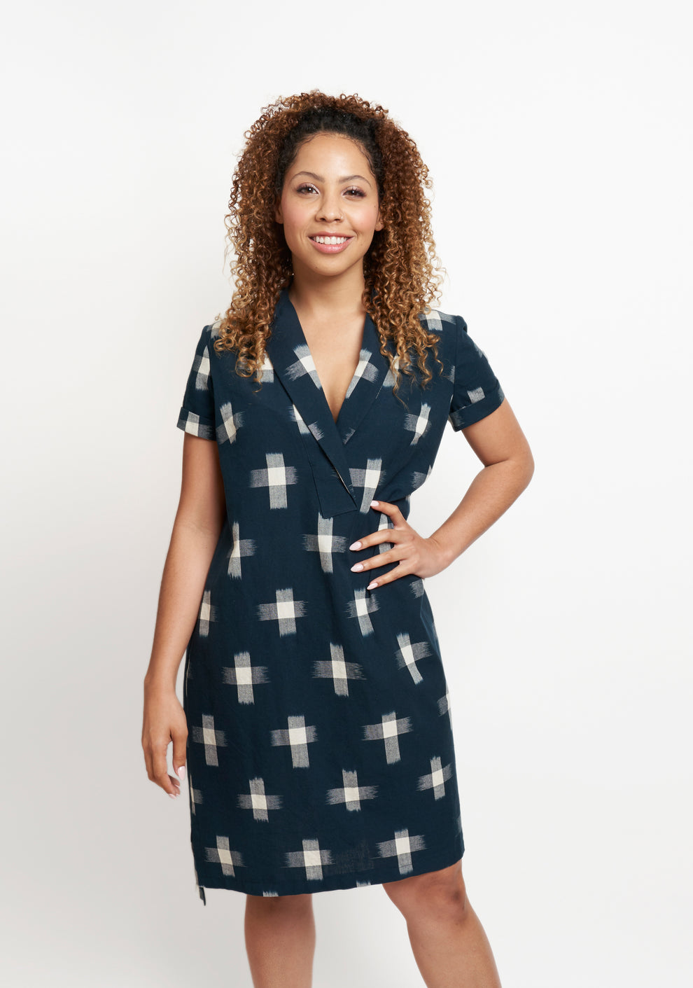 Model: Size 6, 5'5" | Model wearing Augusta Dress with short sleeves in navy cross print, front view hand on hip.