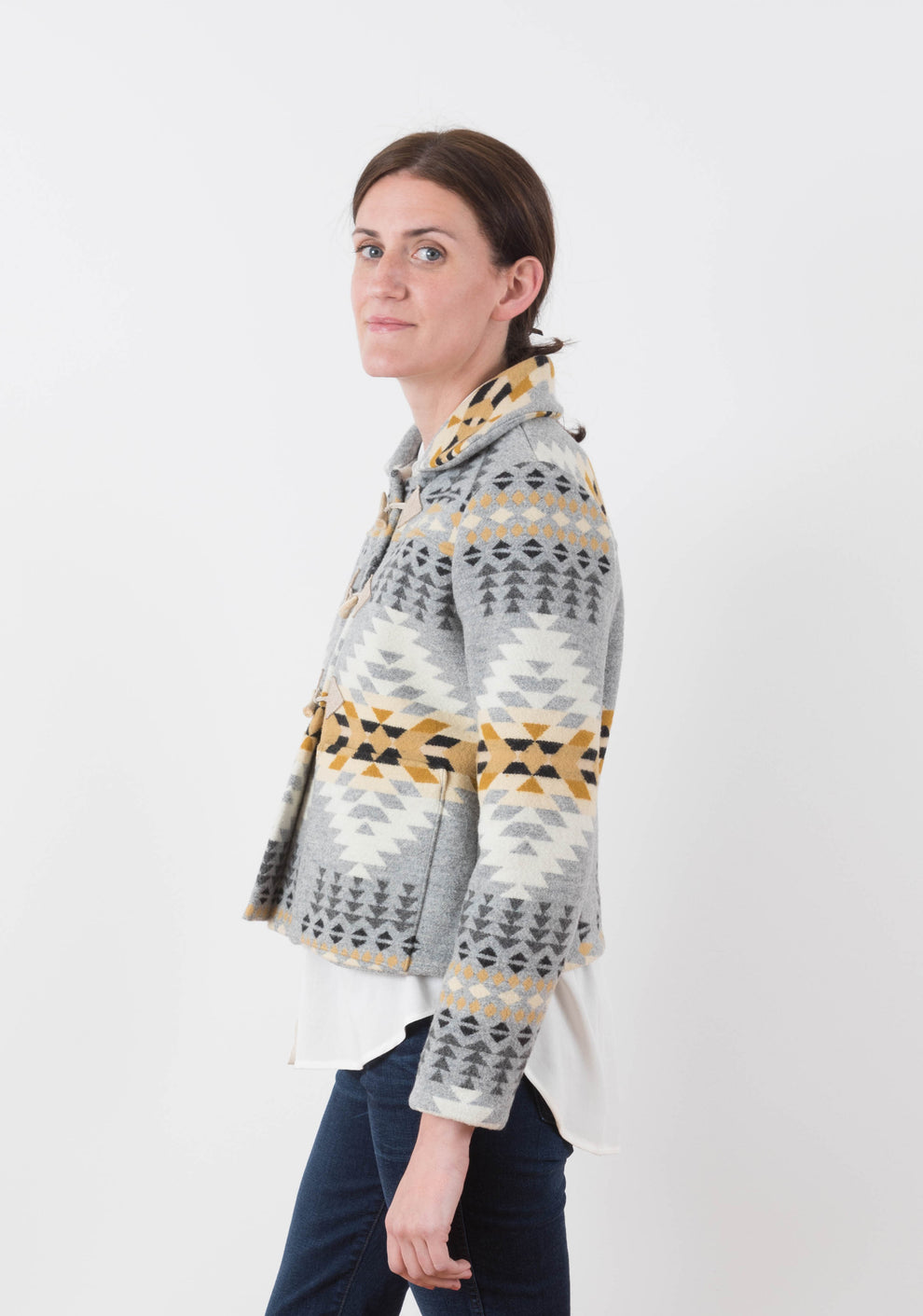 Side view of short Cascade Duffle Coat in grey and gold Pendleton wool with triangle toggle tabs and collar.