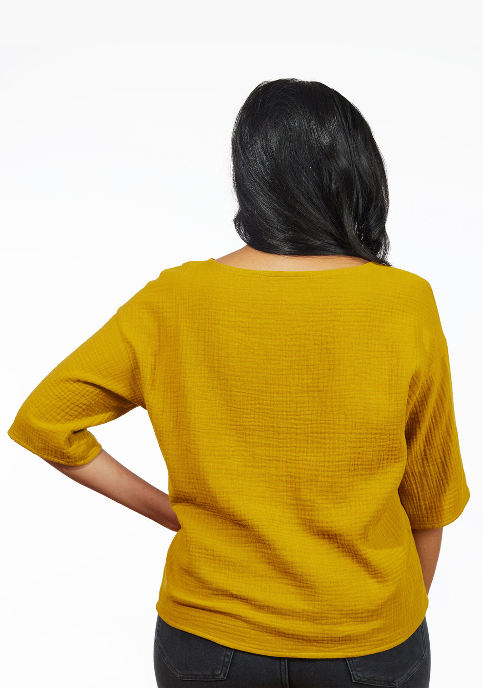 Back view of Corin Top in mustard fabric showing neckline and relaxed fit sleeves.