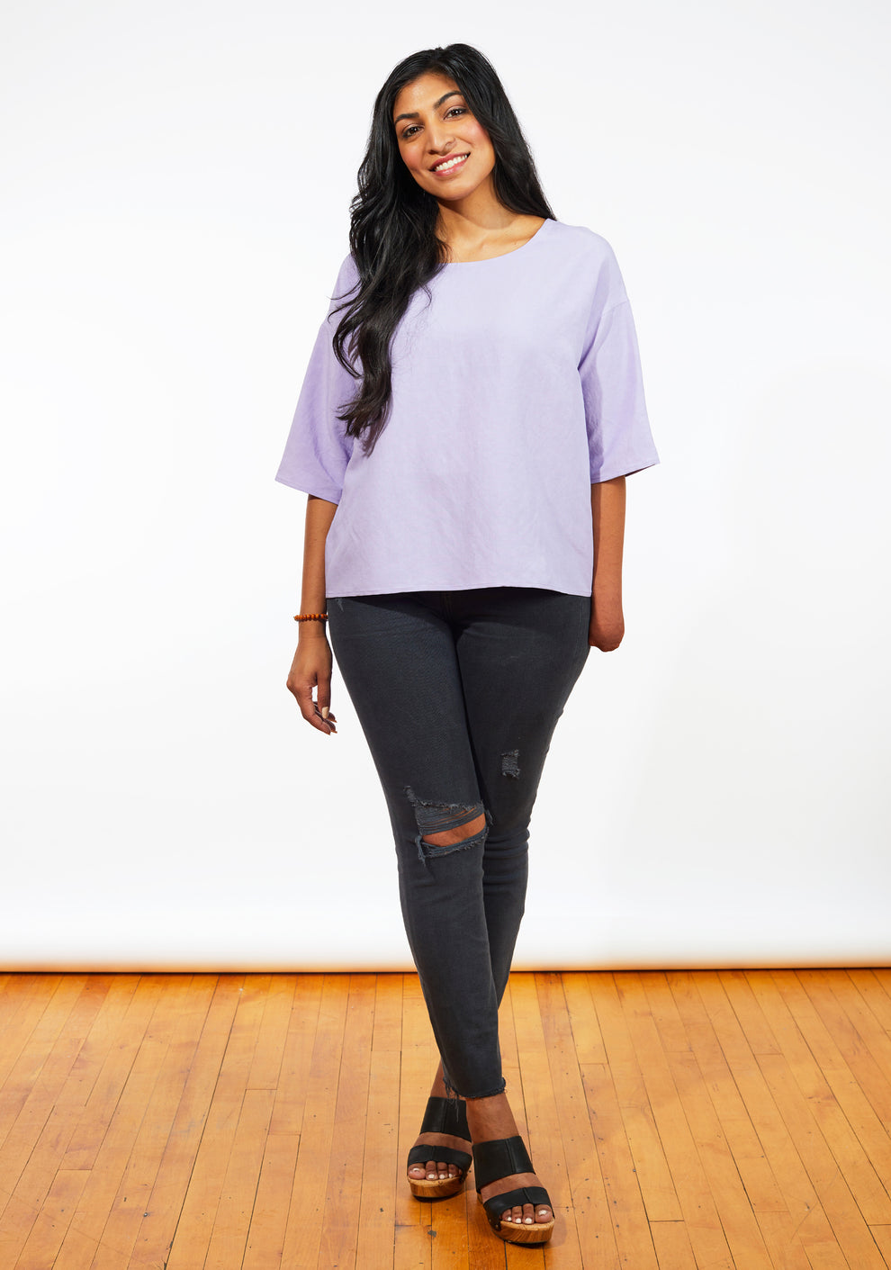 Front view of lilac Corin Top with elbow-length sleeves and relaxed fit in lightweight fabric.